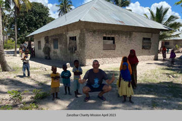 Local children with volunteer during Opsis Clinical Zanzibar Charity Mission in April 2023