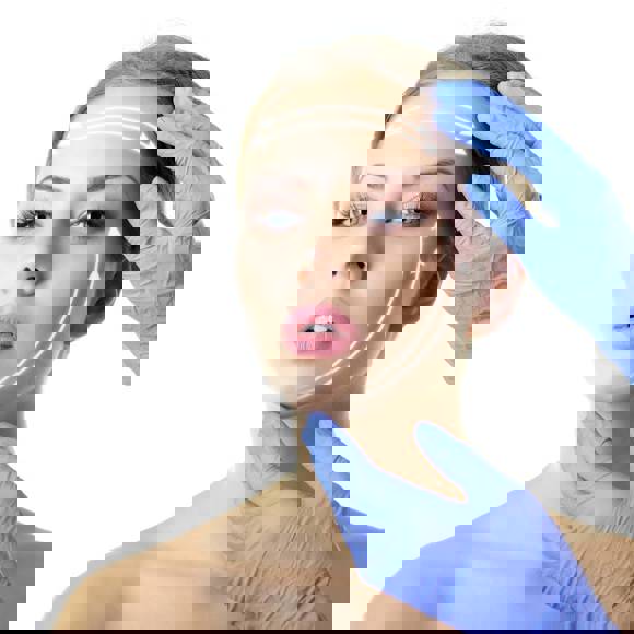 Woman with arrows drawn on her face showing lift directions, touched by gloved hands during face lift consultation