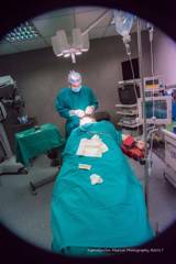 Dr Ioannis Liapakis performing plastic surgery in a fully equipped operation room