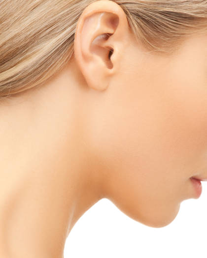 Side-profile portrait highlighting ear contour after otoplasty procedure