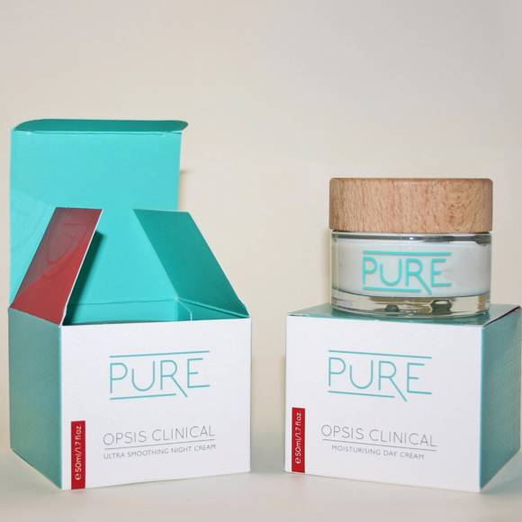 PURE OPSIS Clinical skincare packaging with day and night cream jars and turquoise boxes
