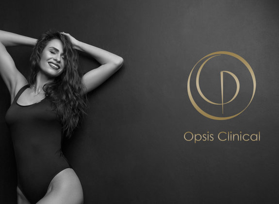 Smiling woman in black bodysuit posing confidently against dark background with the Opsis Clinical logo beside