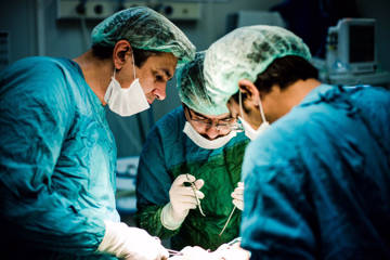 Surgical team performing reconstructive procedure during humanitarian medical mission