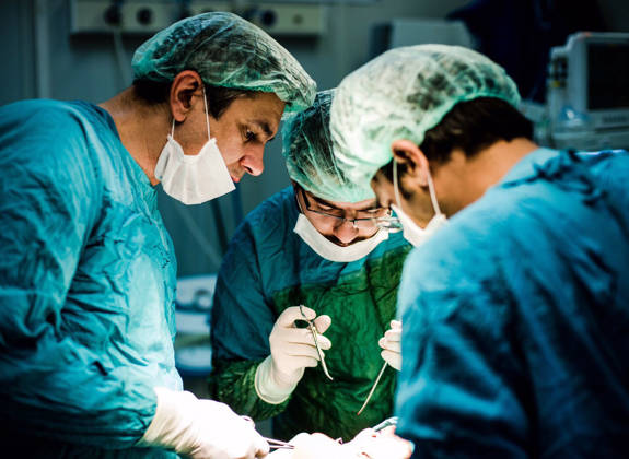 Surgical team performing reconstructive procedure during humanitarian medical mission